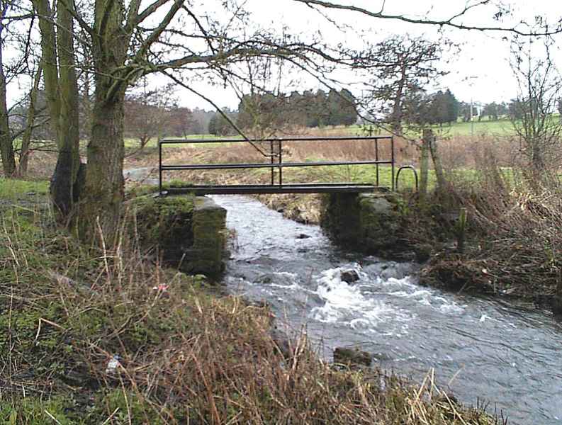 The sluice gate walls now supporting a bridge in 2002. Photo by Neil B. Maw