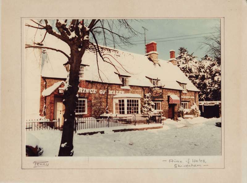 The Prince of Wales public house, Shrivenham, in the snow - a photograph by Mervyn Penny