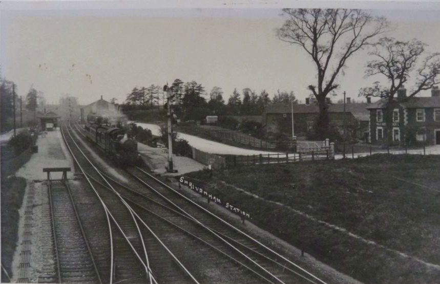 Shrivenham Station circa 1922 as viewed from the bridge that was erected at that time. The Victoria public house is seen on the right