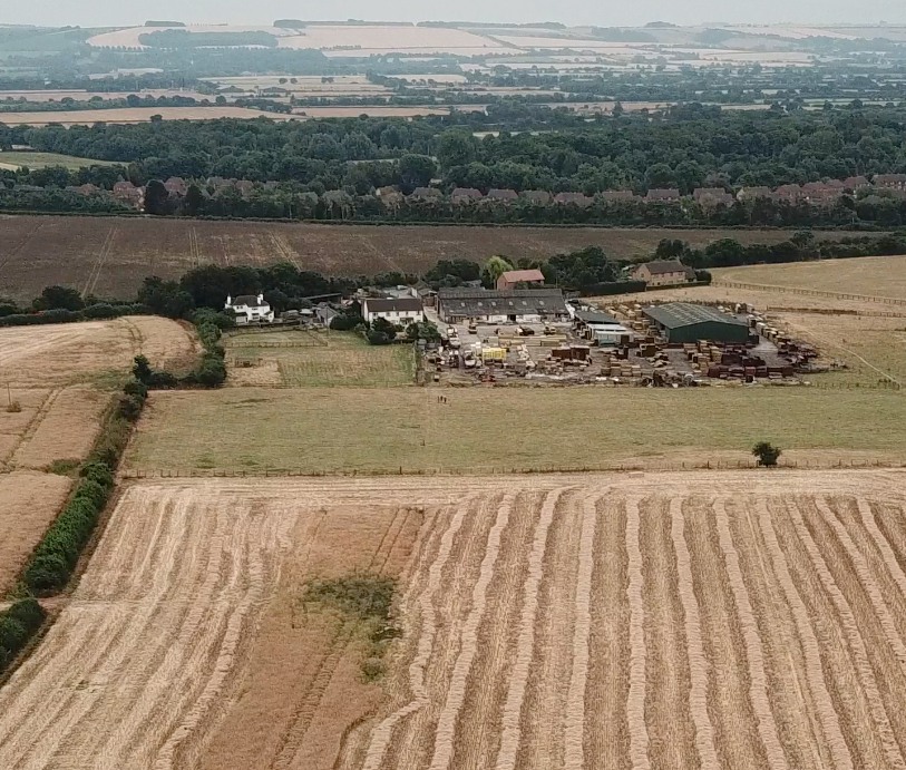 An aerial view of the site of Anger Cottage which was centre of photo. The hedge on the left is the physical Parish Boundary.