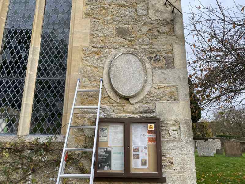 The plaque by the entrance to St Andrew's Church